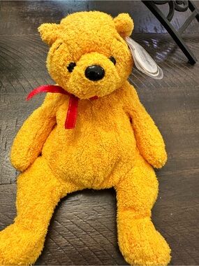 Ty Poopsie the Bright Yellow Beanie Baby Teddy Bear with Red Ribbon